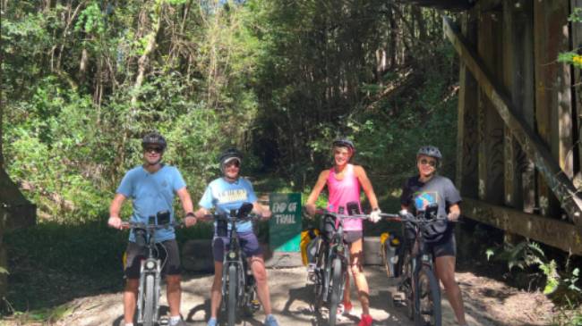 Cyclists at the end of the first stage of the Rail trail at Crabbes Creek | Kate Baker