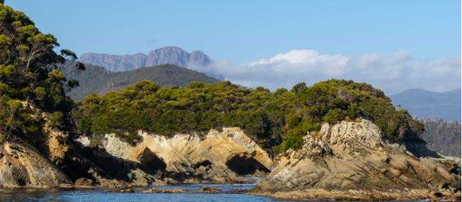 The imposing Ironbound Ranges in the distance on the South Coast Track | John Dalton