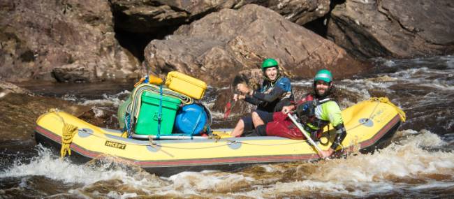 Guides navigating the raft to calmer waters | Glenn Walker